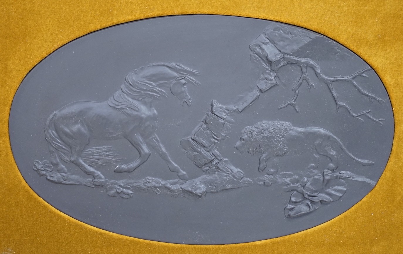 A framed oval Wedgwood black basalt plaque, “ The Frightened Horse”, limited edition 98/250, 39cms wide
